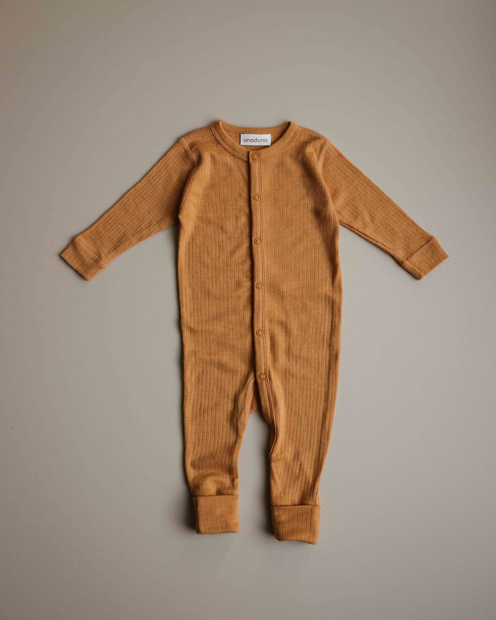unaduna-jumpsuit-baby-inca-gold