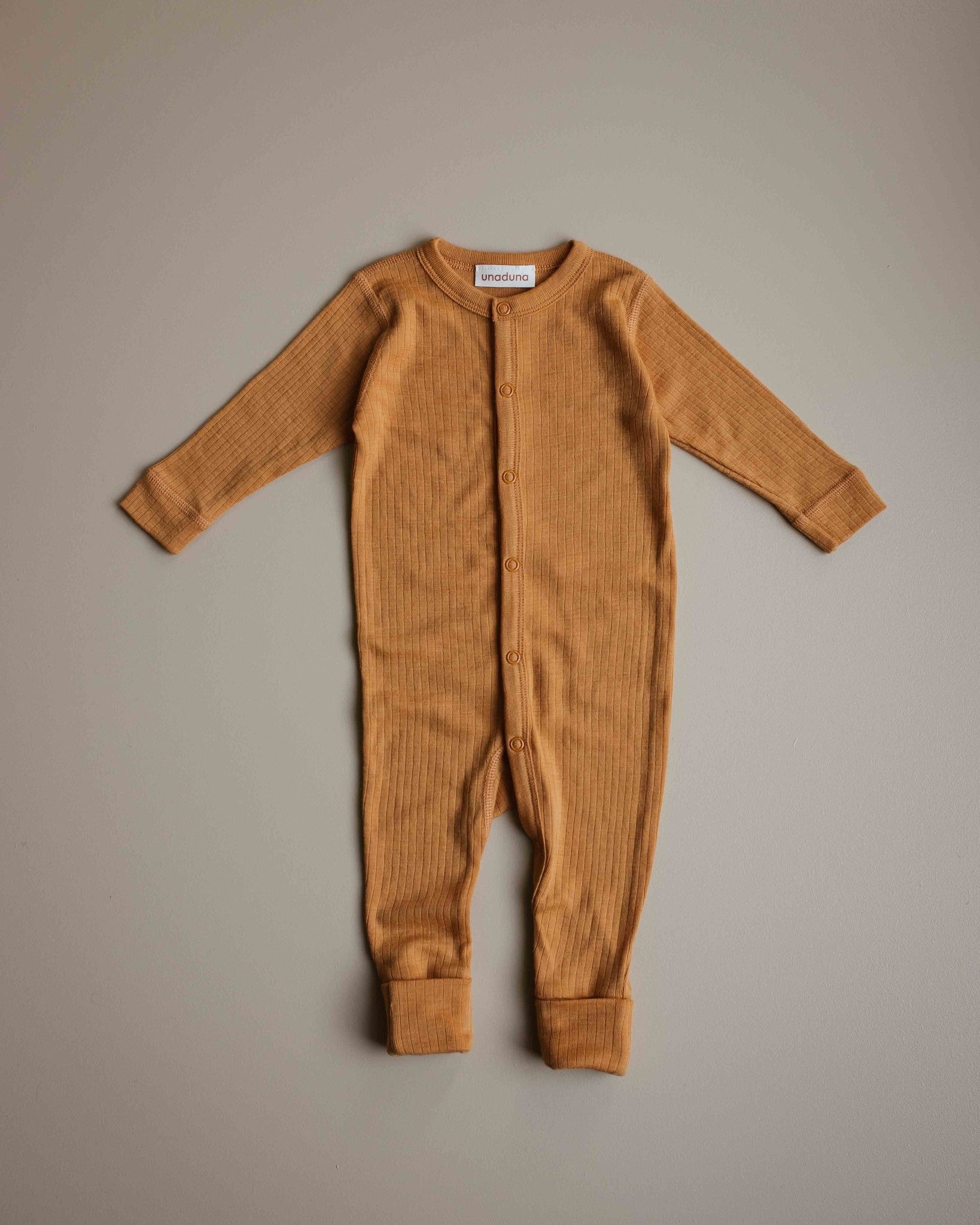unaduna-jumpsuit-baby-inca-gold