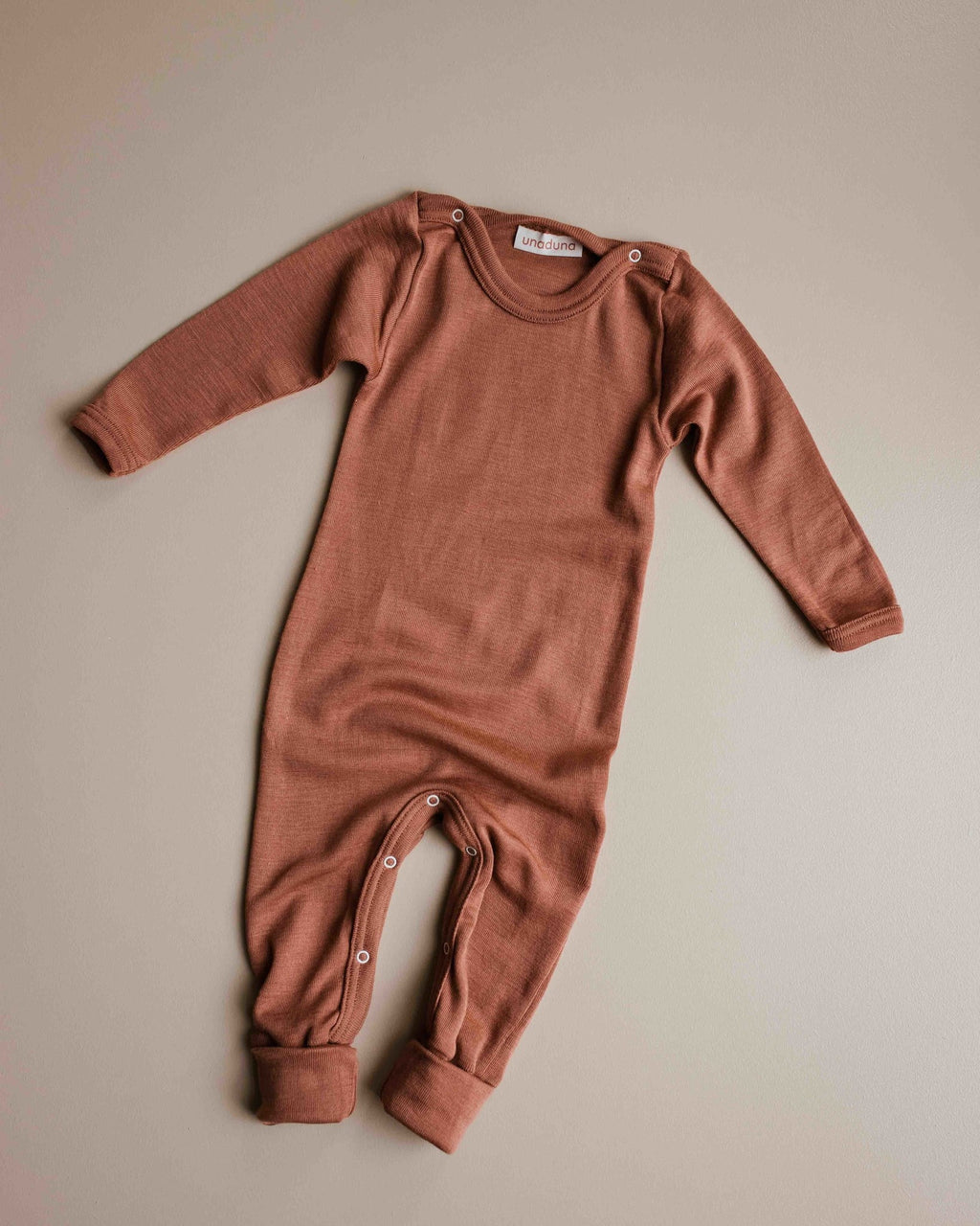 unaduna-sienna-clay-jumpsuit-baby-drukknoopjes-wol