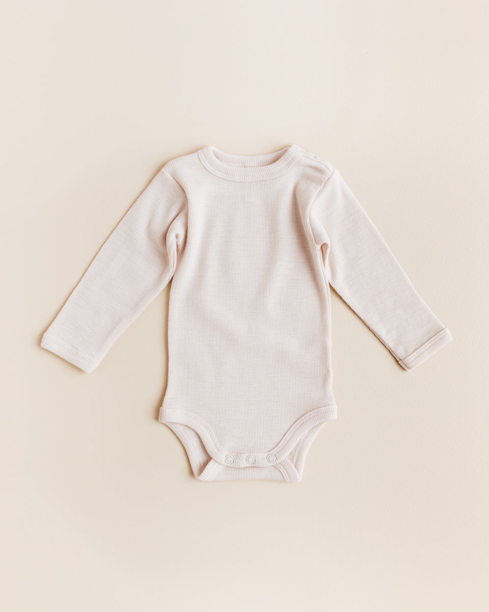unaduna-wollen-rompertje-tiny-rib-mazarin